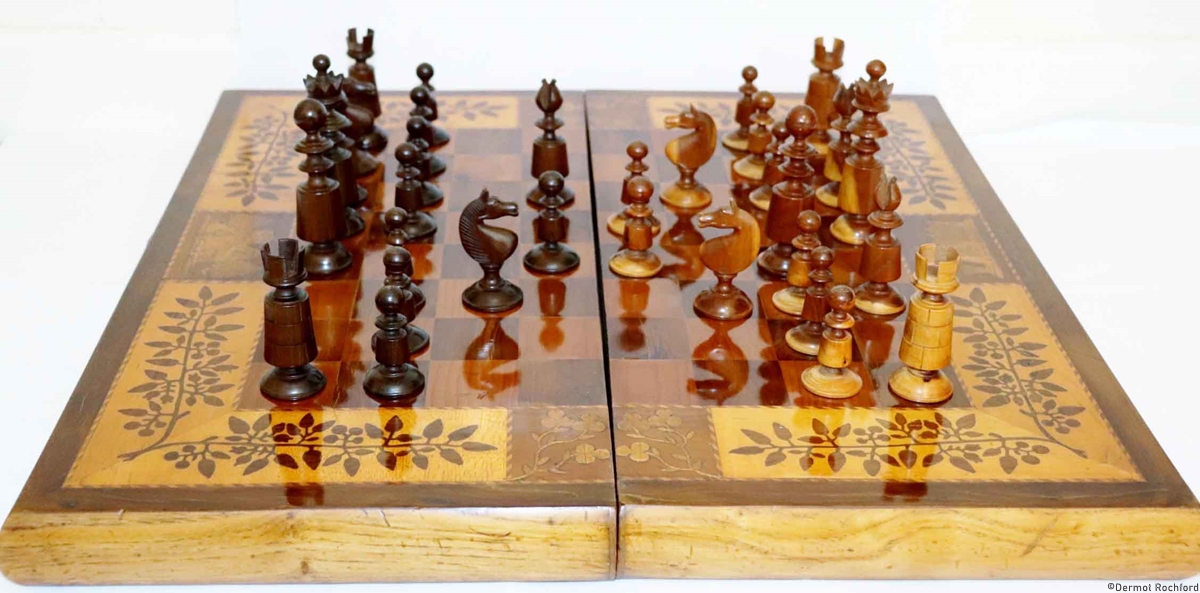 Antique 19th Irish chessboard with mattching chess set